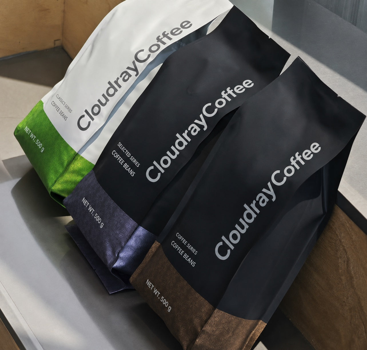 CloudrayCoffee coffee range in silver, black and colored packaging